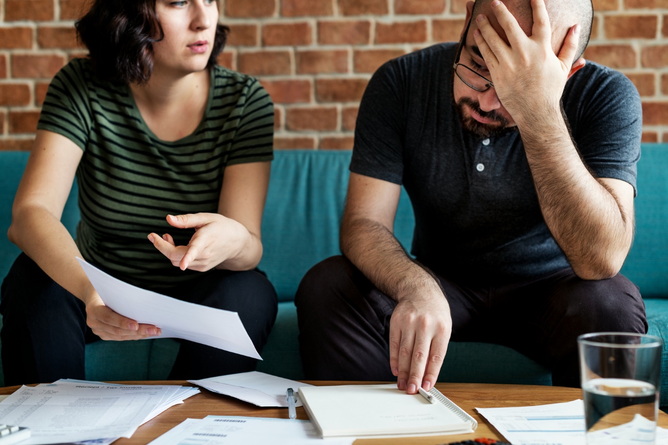 Couple reviewing documents — mediation helps navigate separation constructively